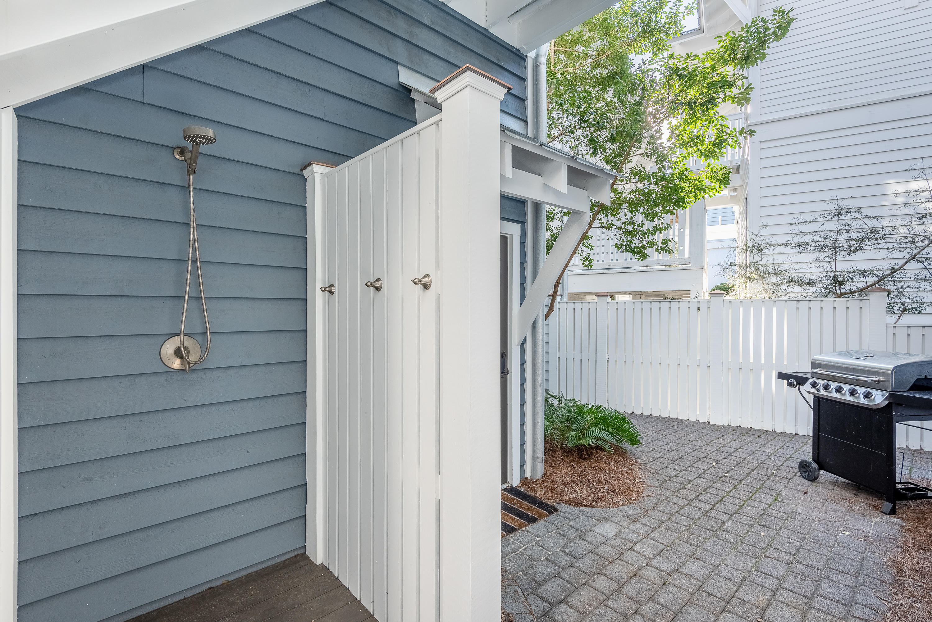 59 West Water Street Inlet Beach, FL 32461 - Photo 26 of 45 a view of a house with a backyard and wooden fence