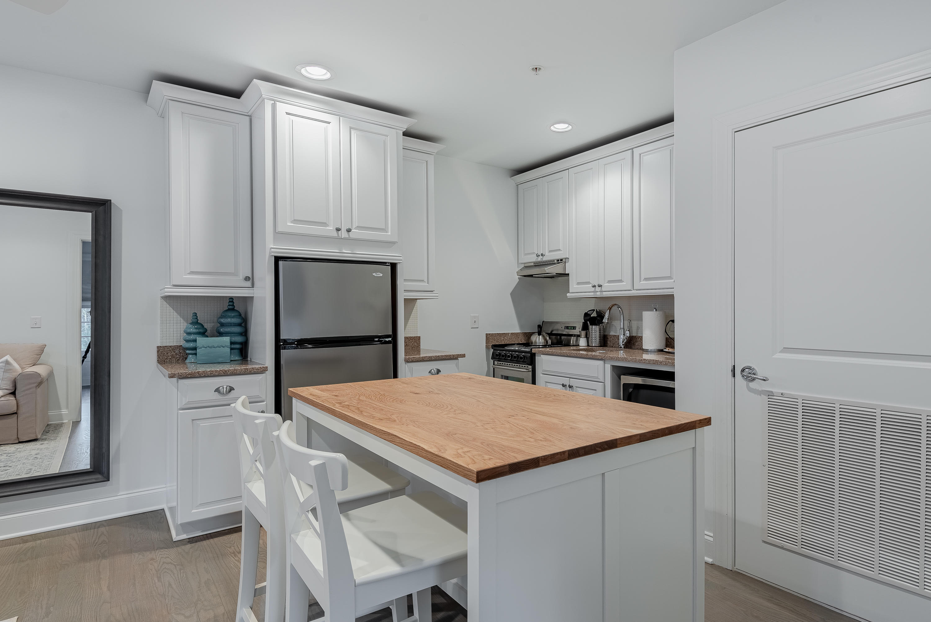 59 West Water Street Inlet Beach, FL 32461 - Photo 29 of 45 a kitchen that has a cabinets and a stove in it