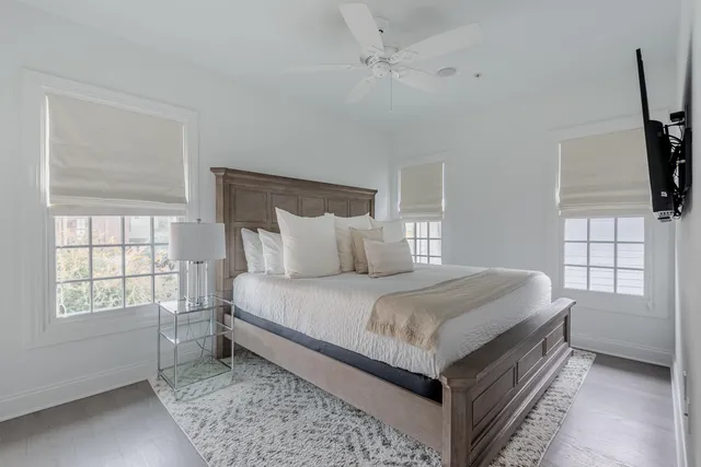 a bedroom with bed and window