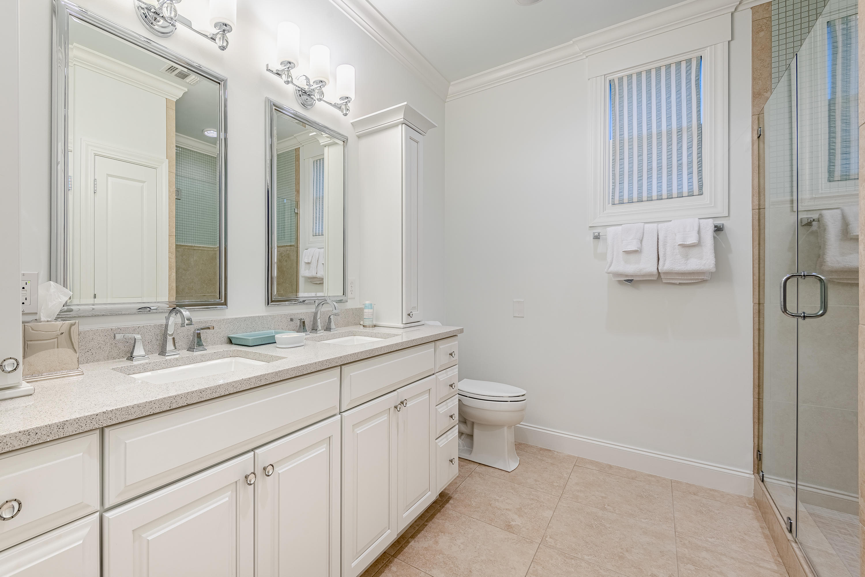 59 West Water Street Inlet Beach, FL 32461 - Photo 9 of 45 a bathroom with a double vanity sink toilet and mirror