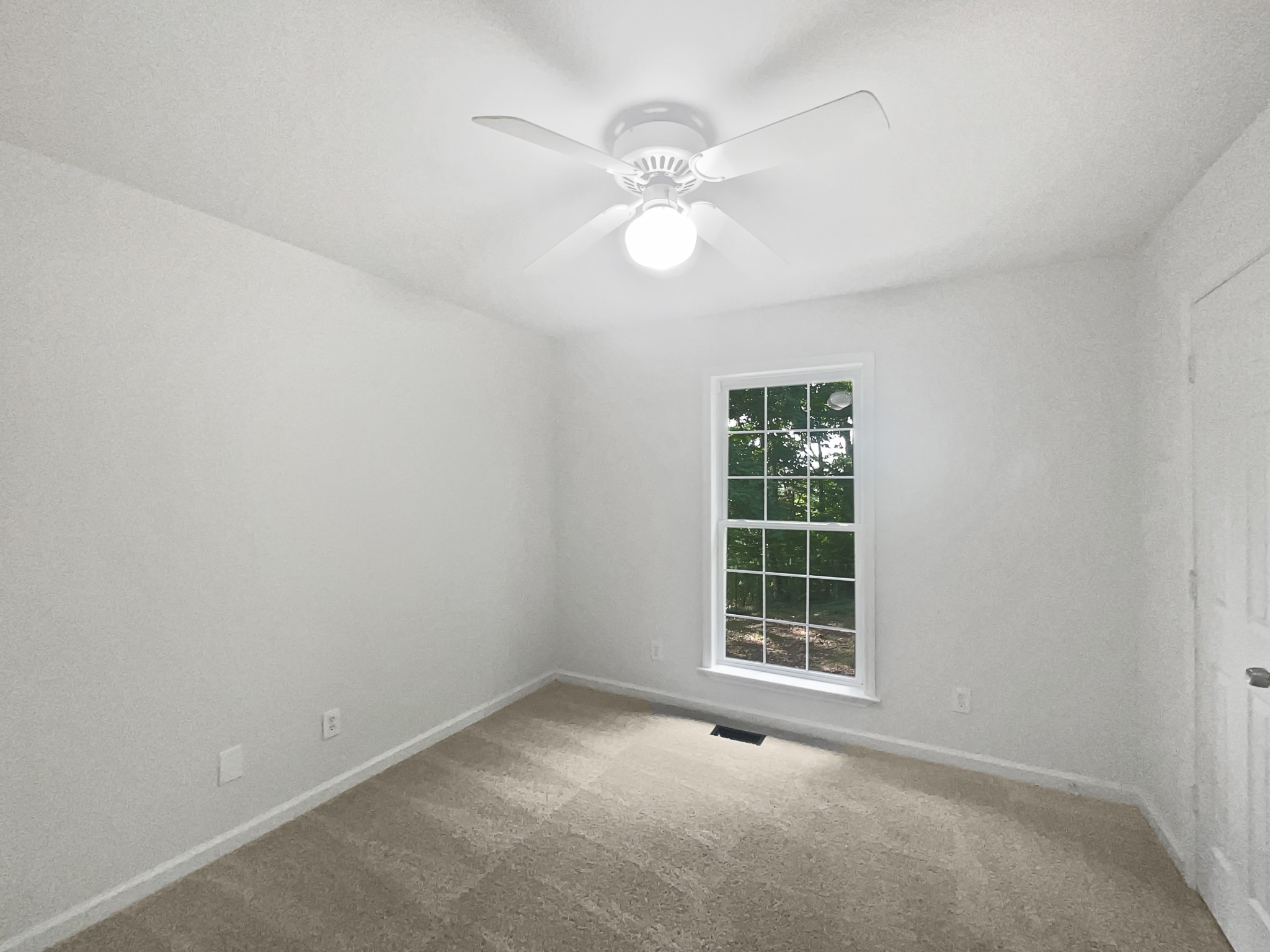 108 Nancy Avenue Pleasant View, TN 37146 - Photo 12 of 20 an empty room with windows and fan