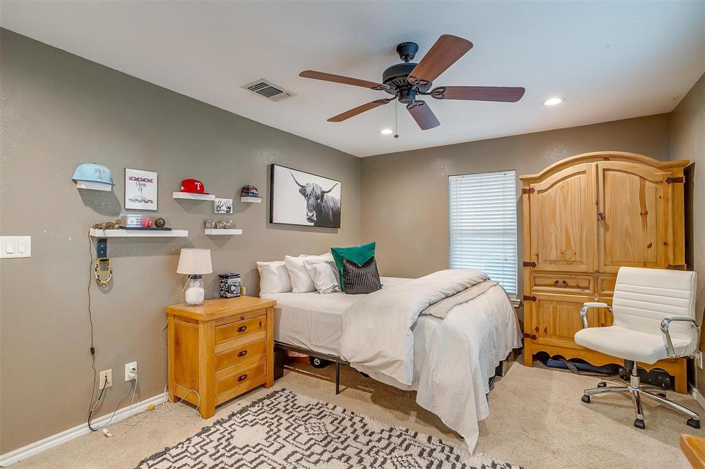 3147 Tin Top Road Weatherford, TX 76087 - Photo 26 of 40 a bedroom with a bed and wooden floor