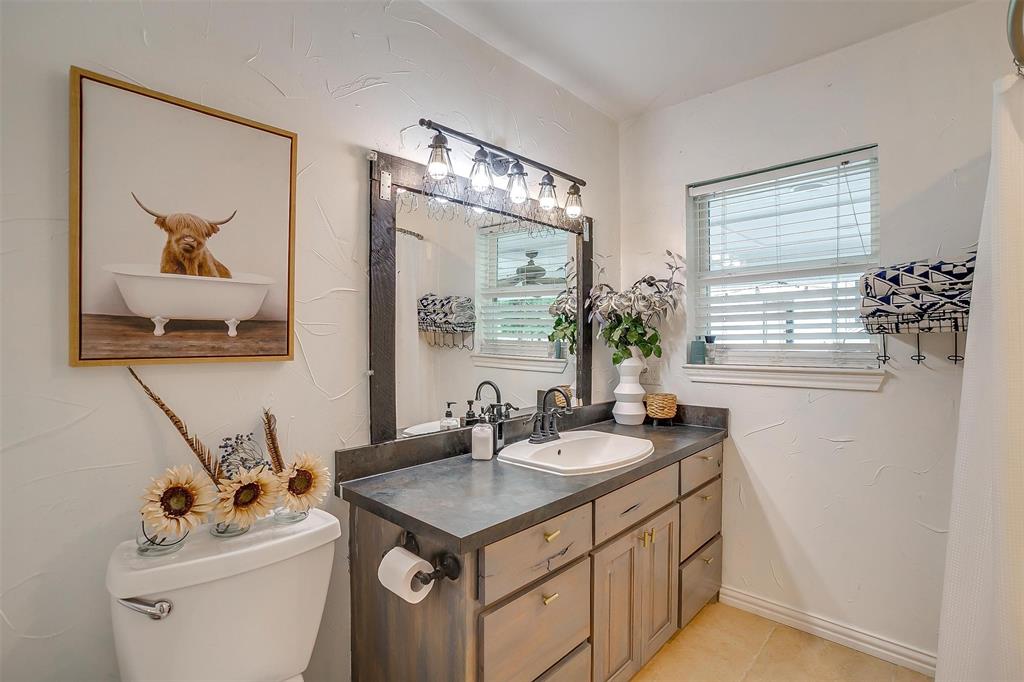 3147 Tin Top Road Weatherford, TX 76087 - Photo 27 of 40 a bathroom with a sink and a mirror