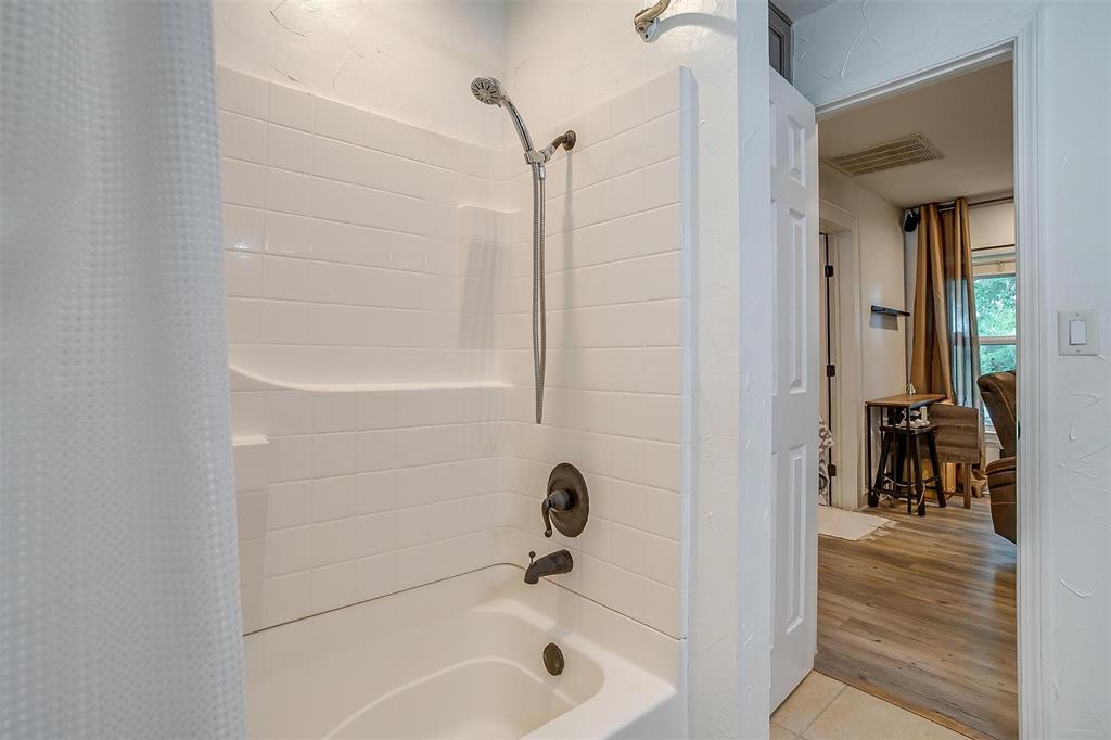 3147 Tin Top Road Weatherford, TX 76087 - Photo 29 of 40 a bathroom with a tub