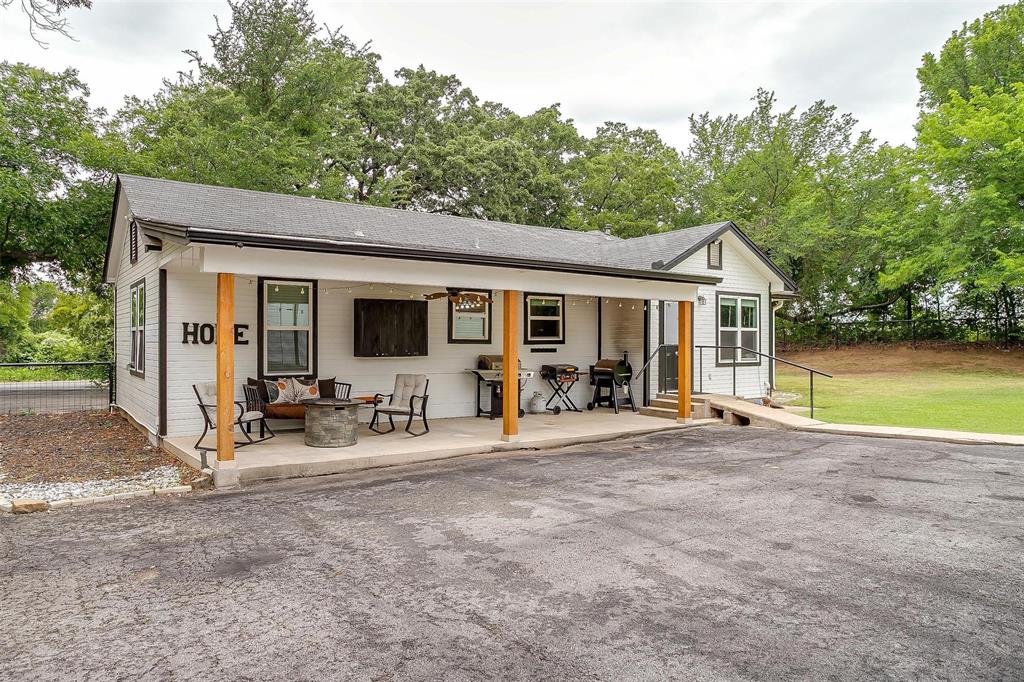 3147 Tin Top Road Weatherford, TX 76087 - Photo 3 of 40 a view of a house with backyard sitting area and garden