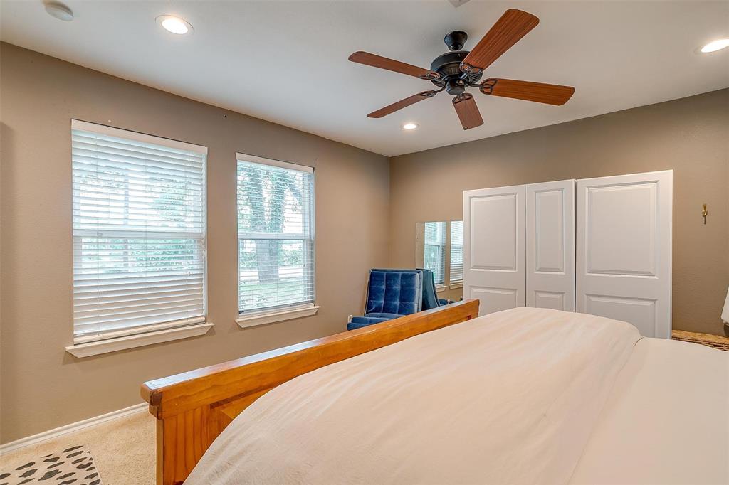 3147 Tin Top Road Weatherford, TX 76087 - Photo 32 of 40 a bedroom with a large bed and a large window