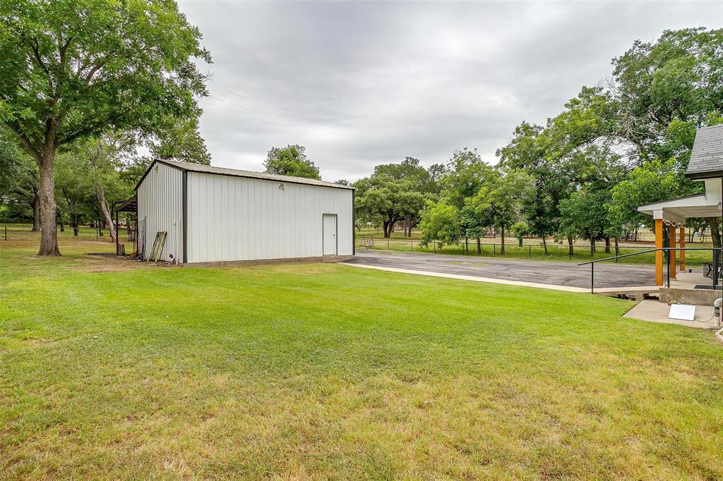 3147 Tin Top Road Weatherford, TX 76087 - Photo 36 of 40 a house view with swimming pool in front of it
