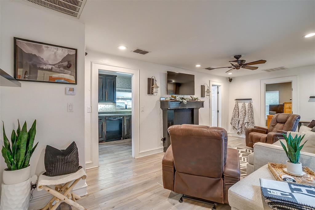 3147 Tin Top Road Weatherford, TX 76087 - Photo 6 of 40 a living room with furniture kitchen view and a potted plant