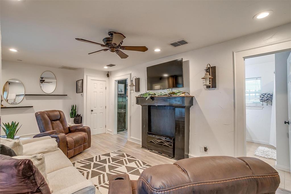 3147 Tin Top Road Weatherford, TX 76087 - Photo 9 of 40 a living room with furniture a flat screen tv and kitchen view