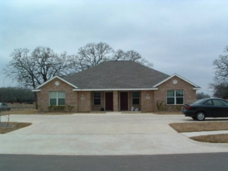 3522 Paloma Ridge Drive College Station, TX 77845 - Photo 1 of 10 a front view of a house with a yard and garage