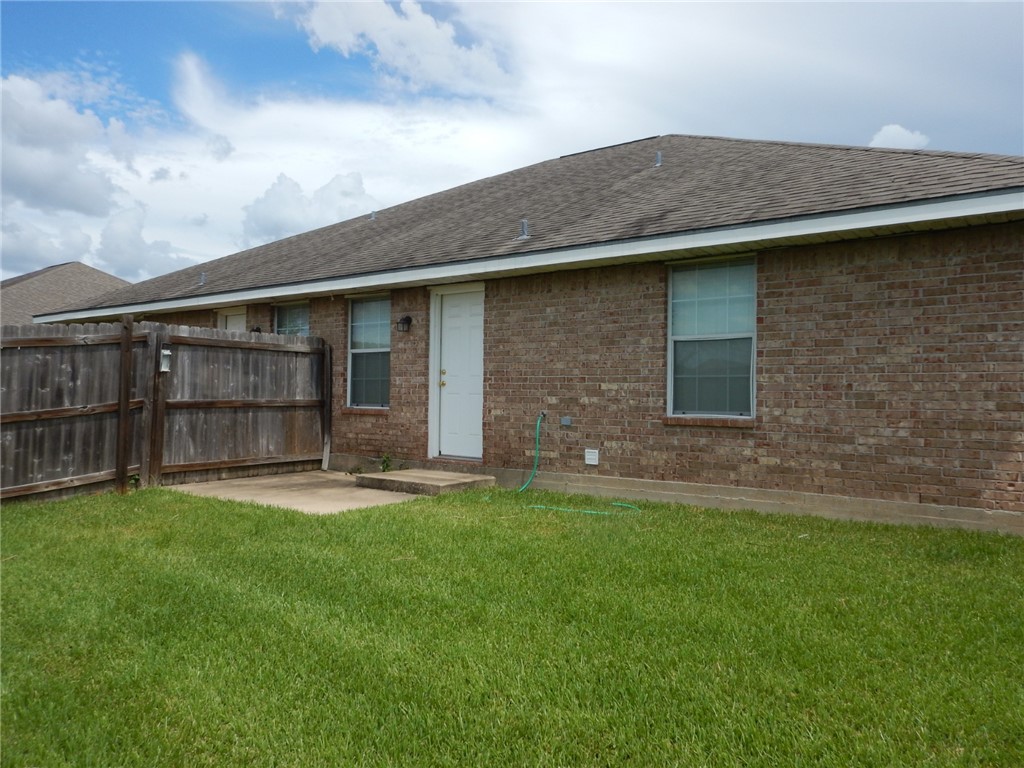 3522 Paloma Ridge Drive College Station, TX 77845 - Photo 9 of 10 a backyard of a house with table and chairs