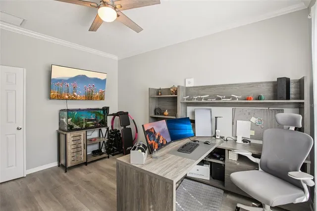 a bathroom with a granite countertop sink vanity mirror bathtub shower and a toilet