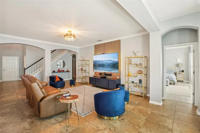 a living room with furniture and a large window