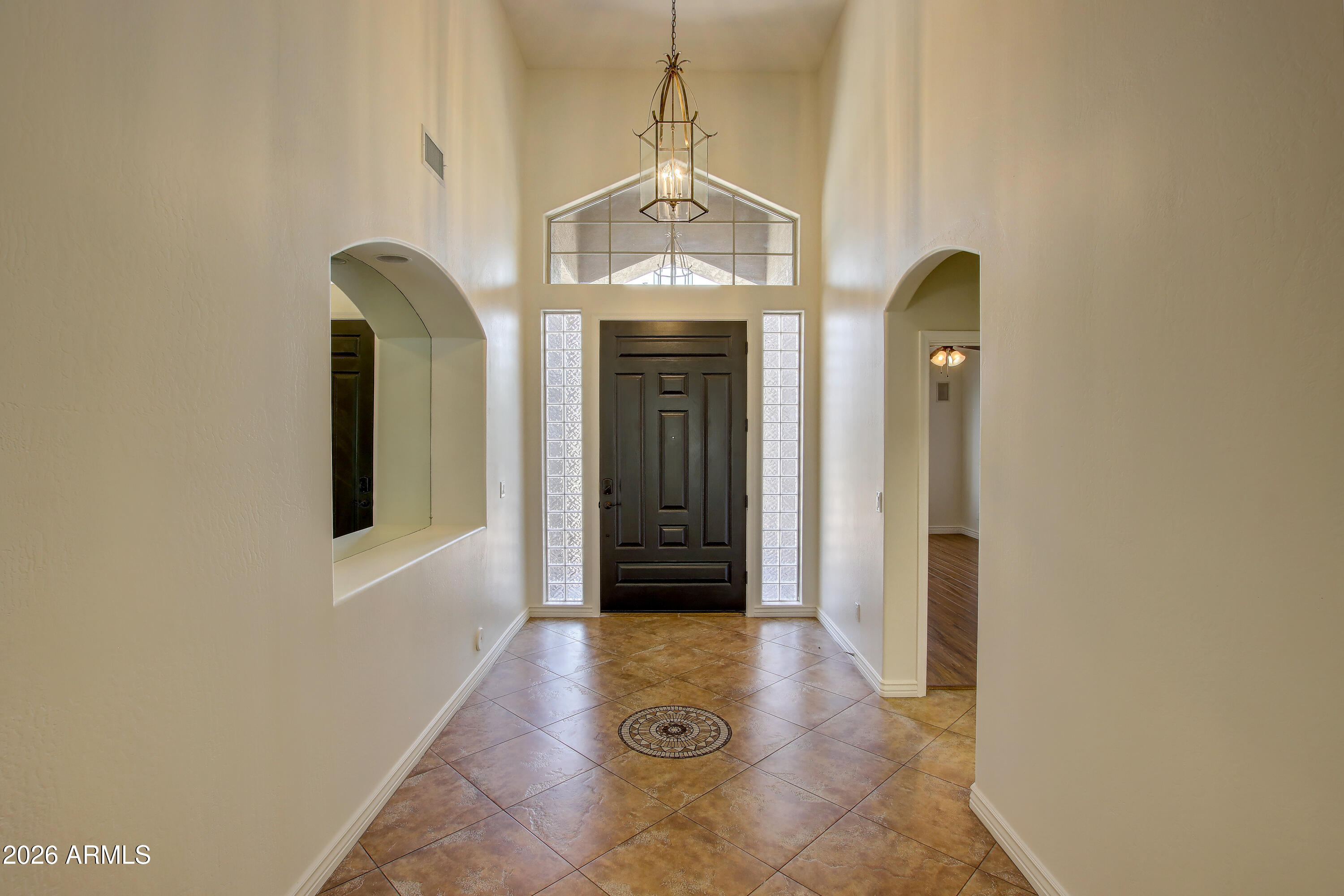 1918 East Marilyn Road Phoenix, AZ 85022 - Photo 16 of 43 a view of a hallway with wooden floor and staircase