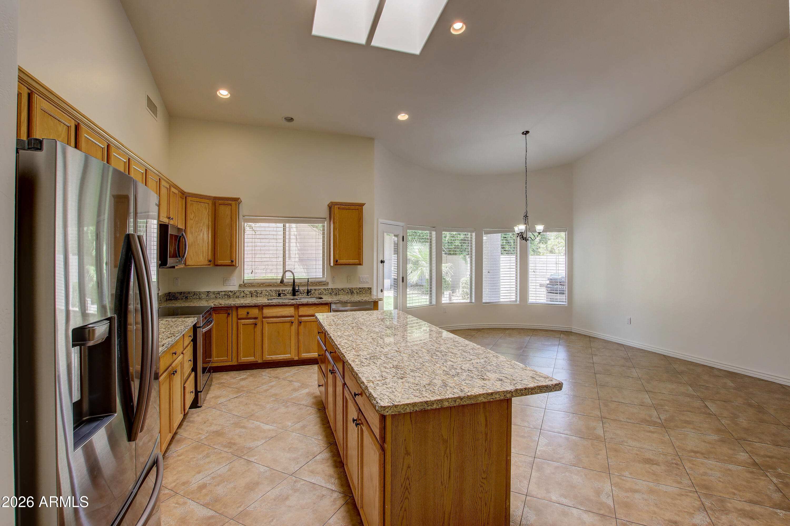 1918 East Marilyn Road Phoenix, AZ 85022 - Photo 18 of 43 a kitchen with refrigerator a stove and a sink