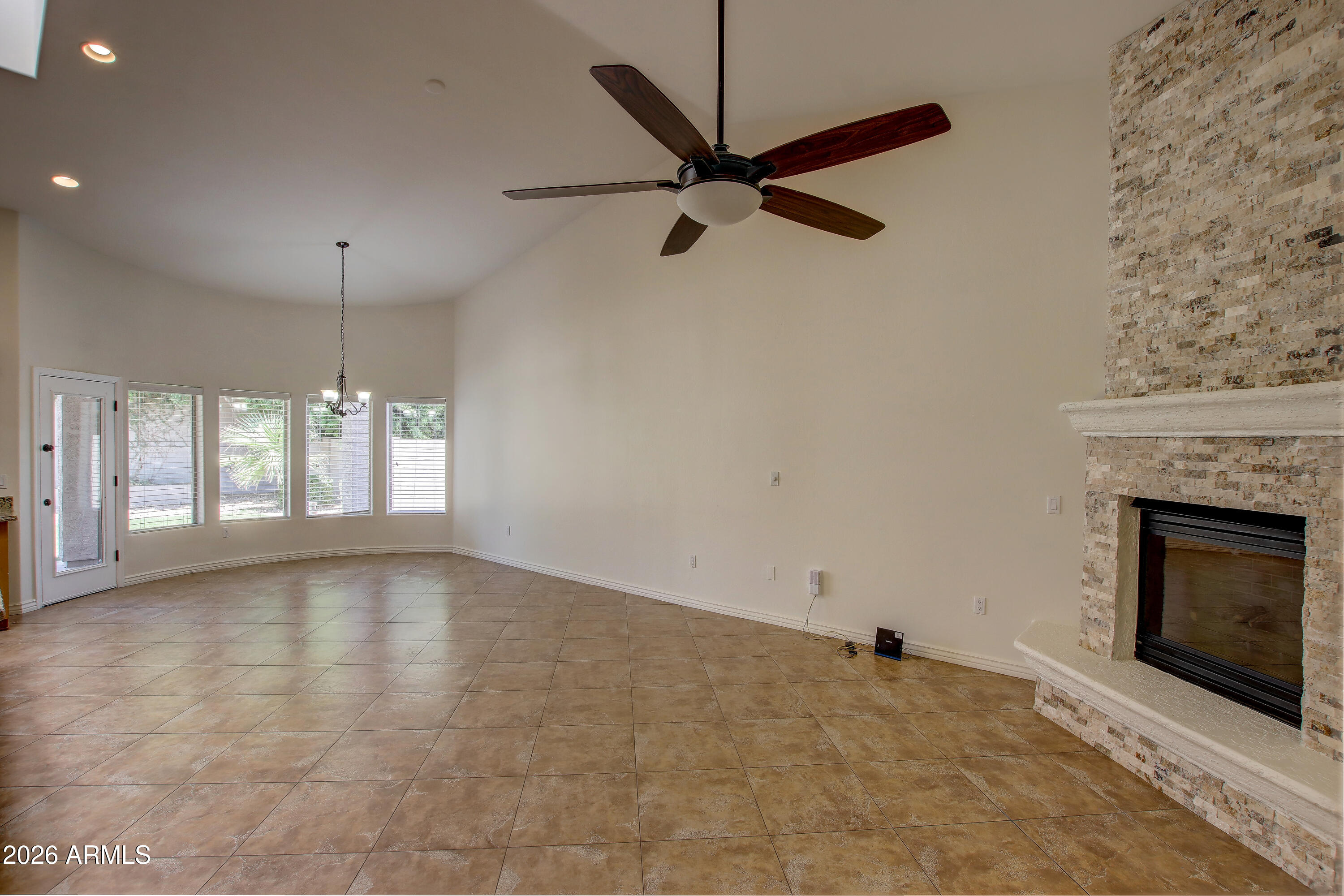 1918 East Marilyn Road Phoenix, AZ 85022 - Photo 20 of 43 a view of an empty room with a fireplace and a window