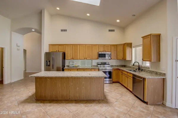 a large kitchen with stainless steel appliances