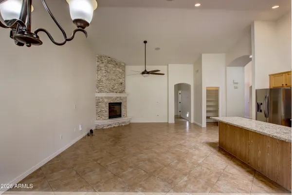 a view of a kitchen with a sink and a fireplace