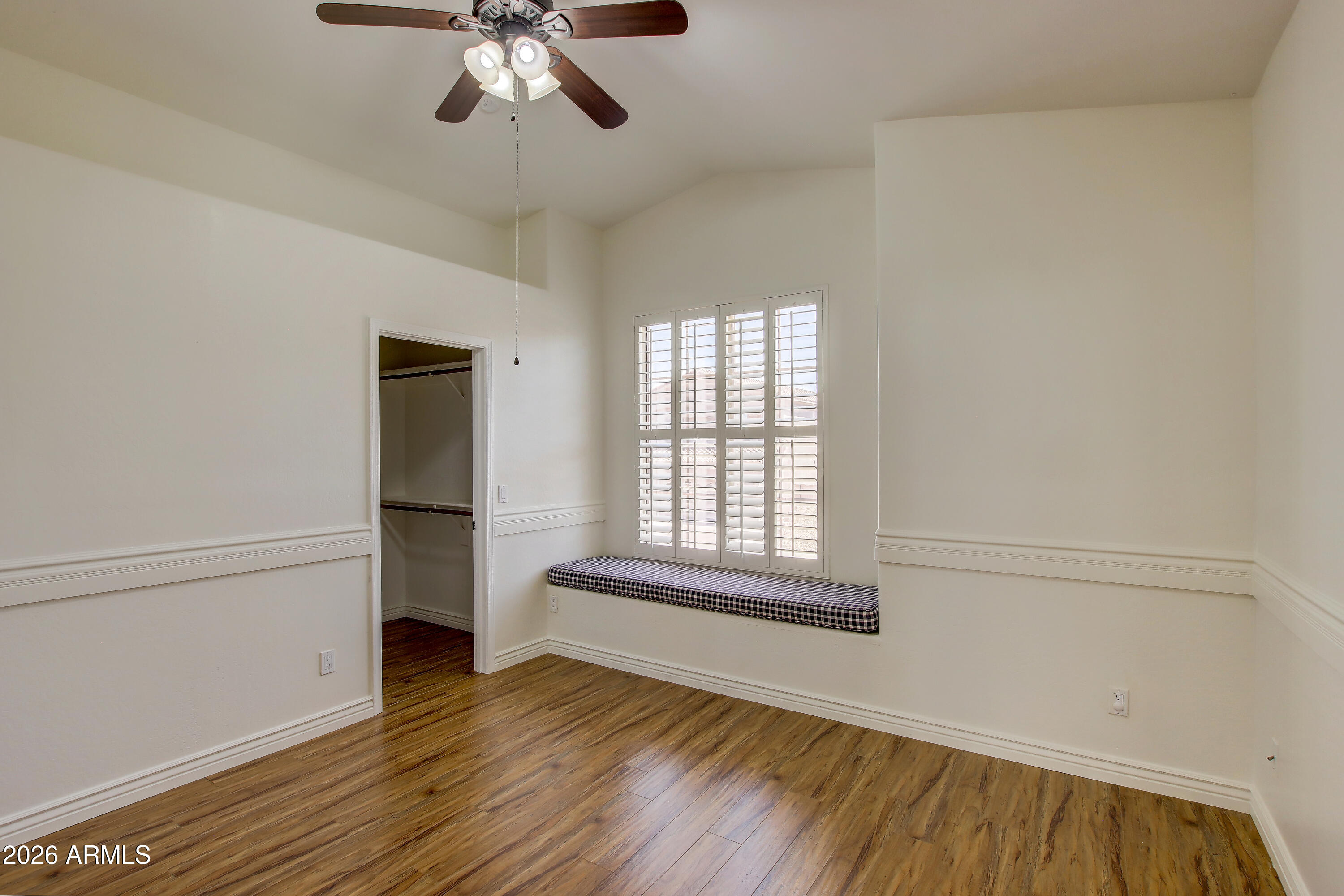 1918 East Marilyn Road Phoenix, AZ 85022 - Photo 30 of 43 an empty room with wooden floor chandelier and windows