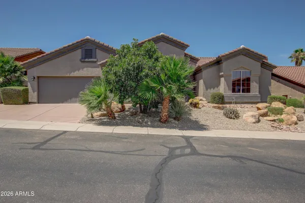 front view of a house with a yard