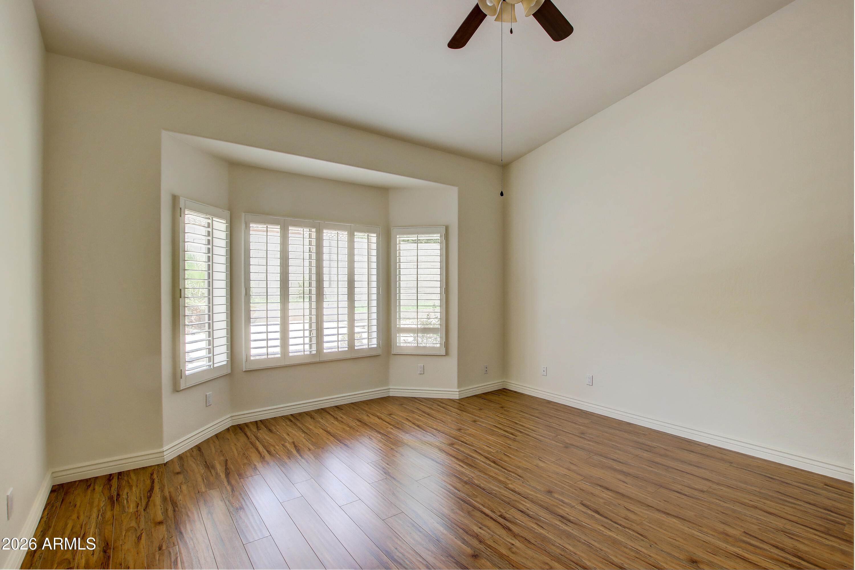 1918 East Marilyn Road Phoenix, AZ 85022 - Photo 35 of 43 wooden floor in an empty room with a window
