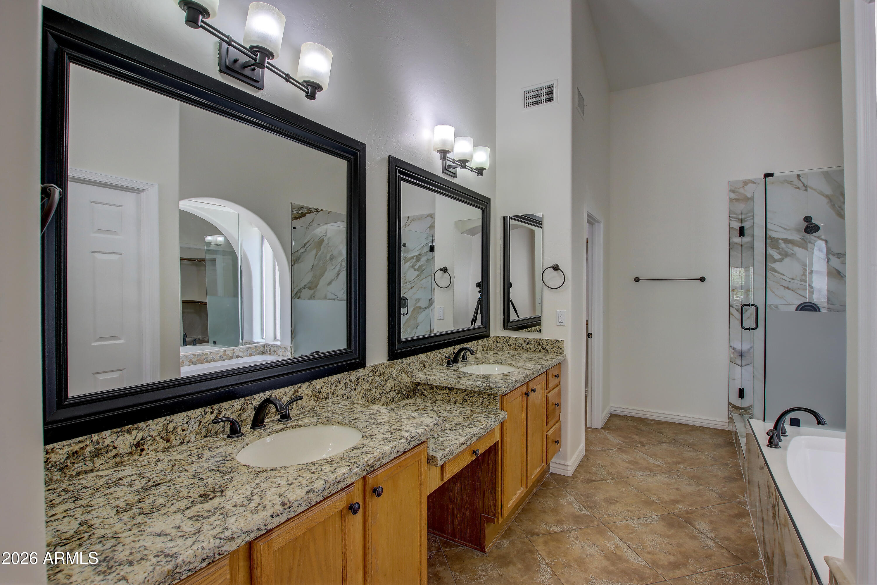 1918 East Marilyn Road Phoenix, AZ 85022 - Photo 36 of 43 a bathroom with a granite countertop sink and a mirror