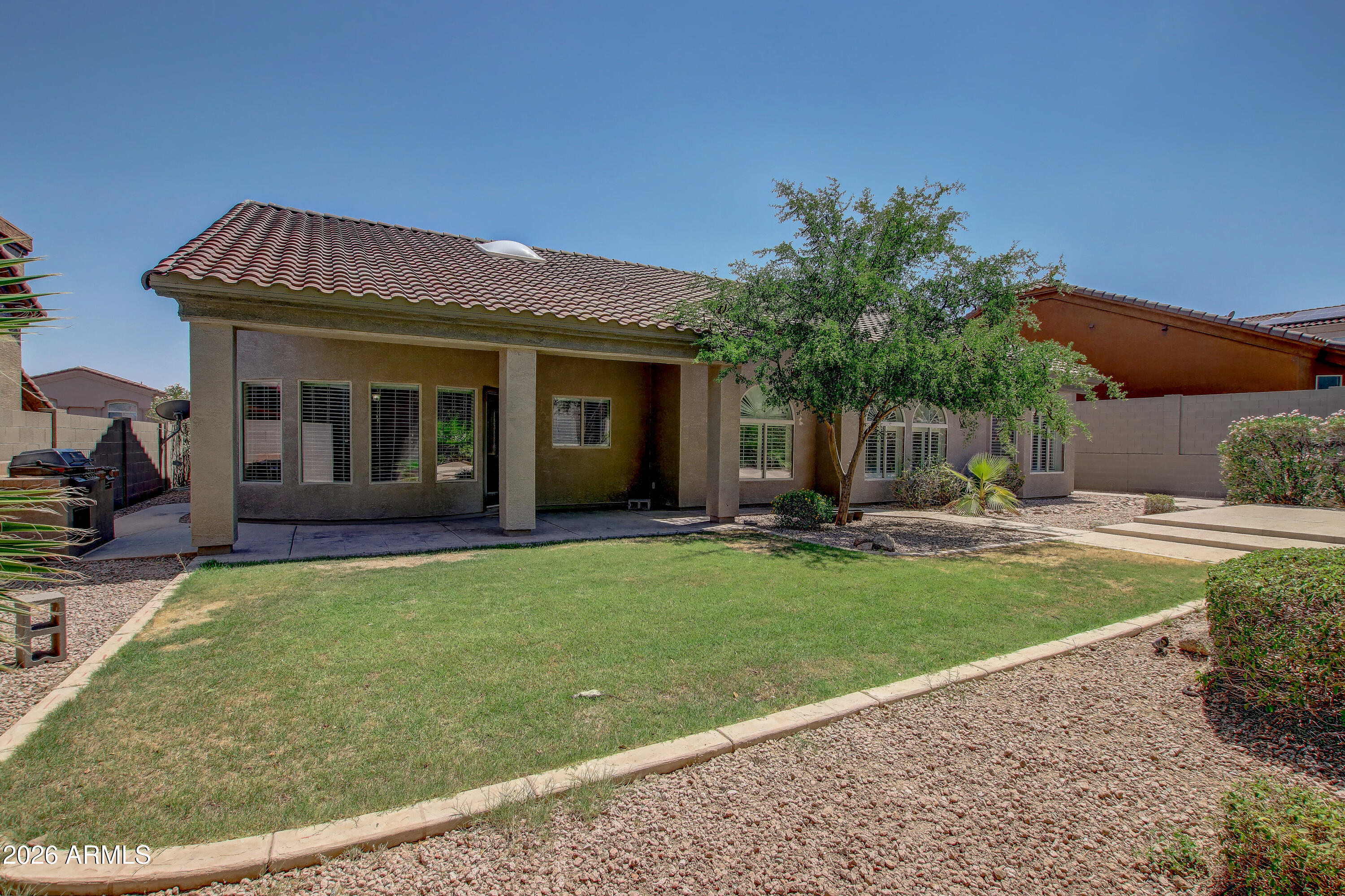 1918 East Marilyn Road Phoenix, AZ 85022 - Photo 41 of 43 a view of a house with a swimming pool and a yard