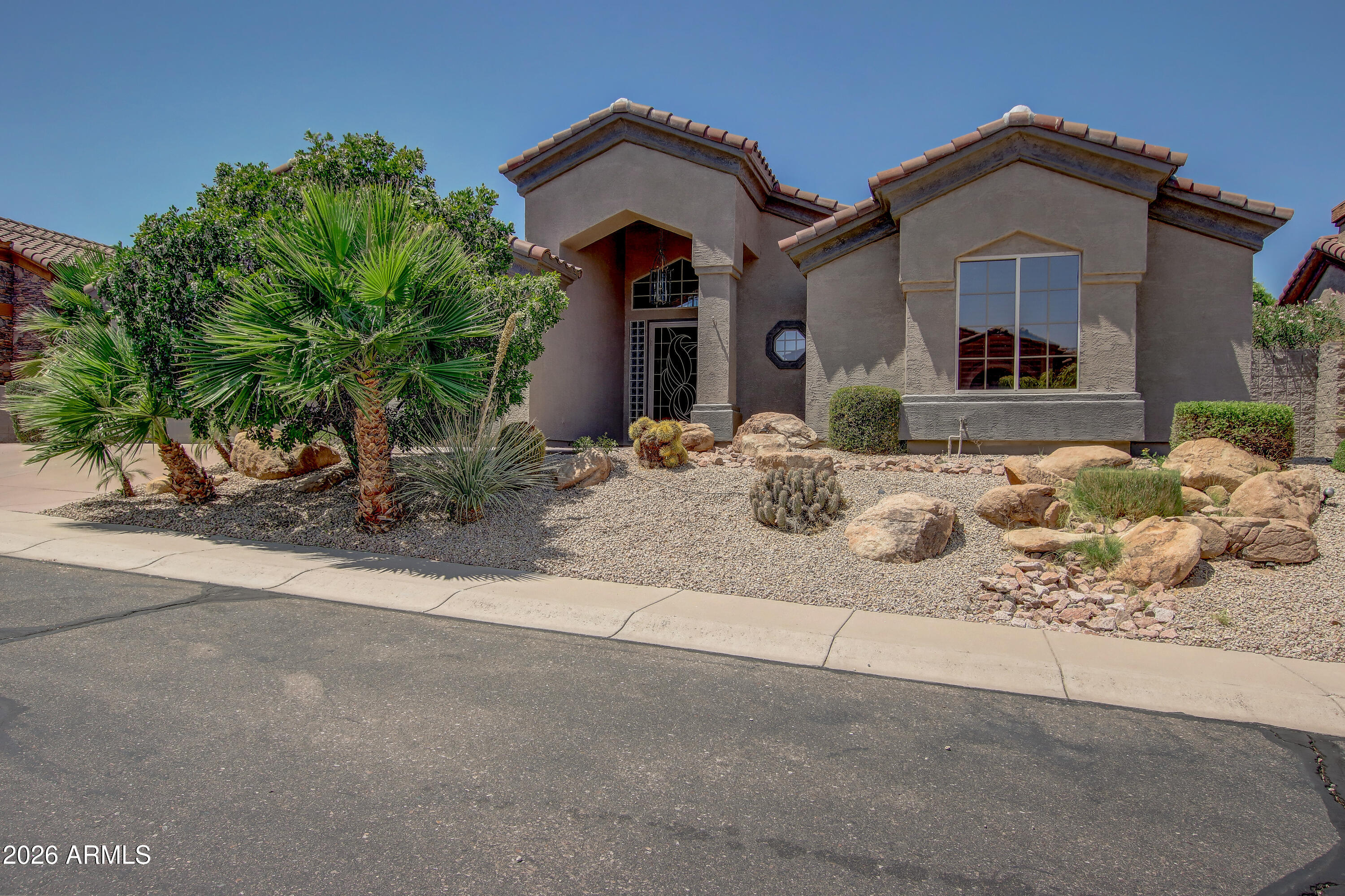 1918 East Marilyn Road Phoenix, AZ 85022 - Photo 5 of 43 a front view of a house with table and chairs