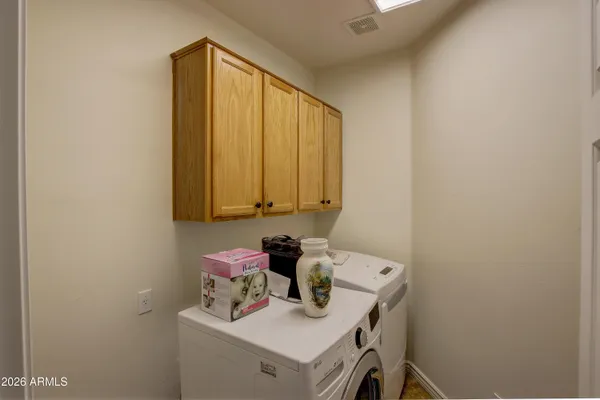 a bathroom with a sink a vanity and a window