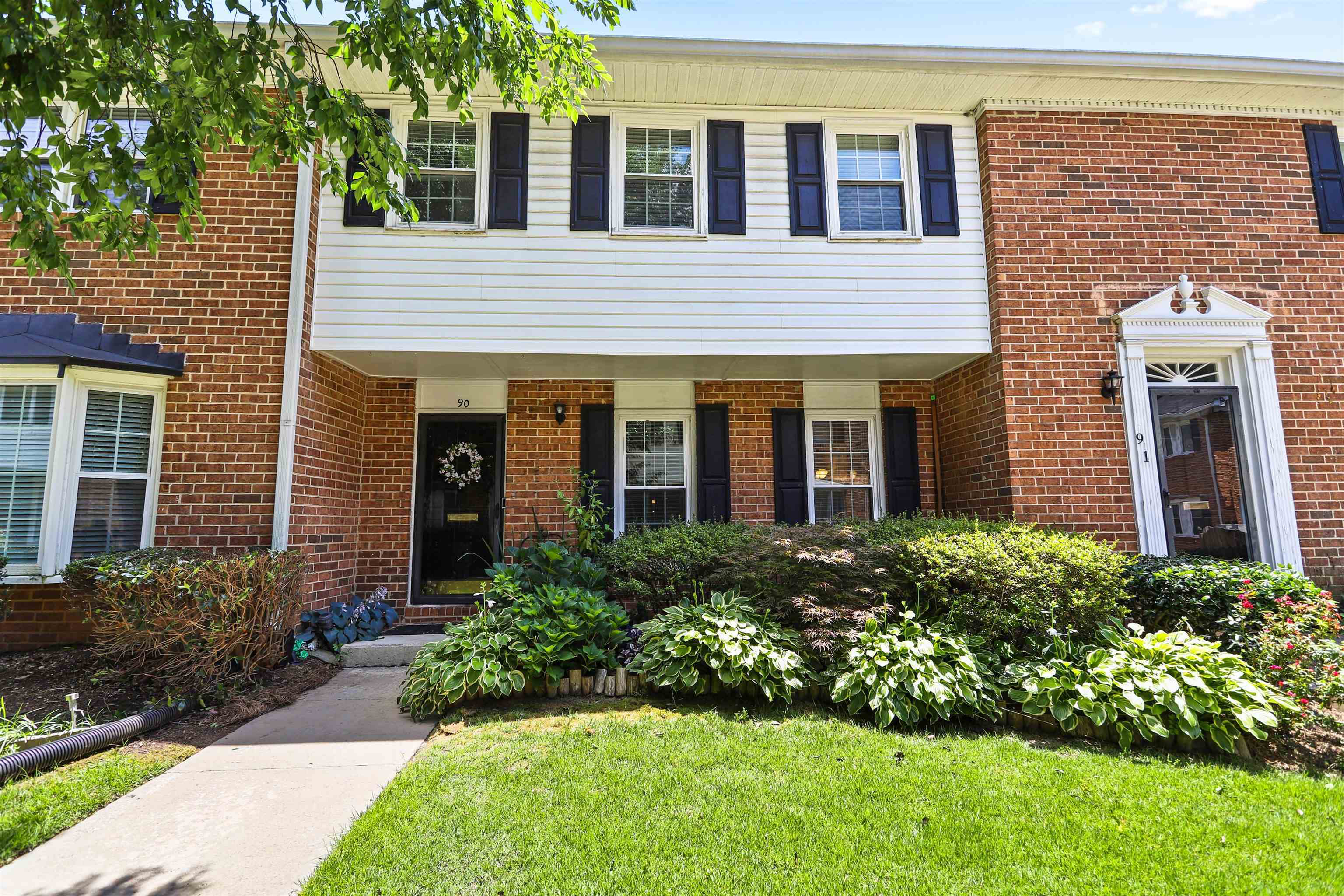 a view of a house with brick walls