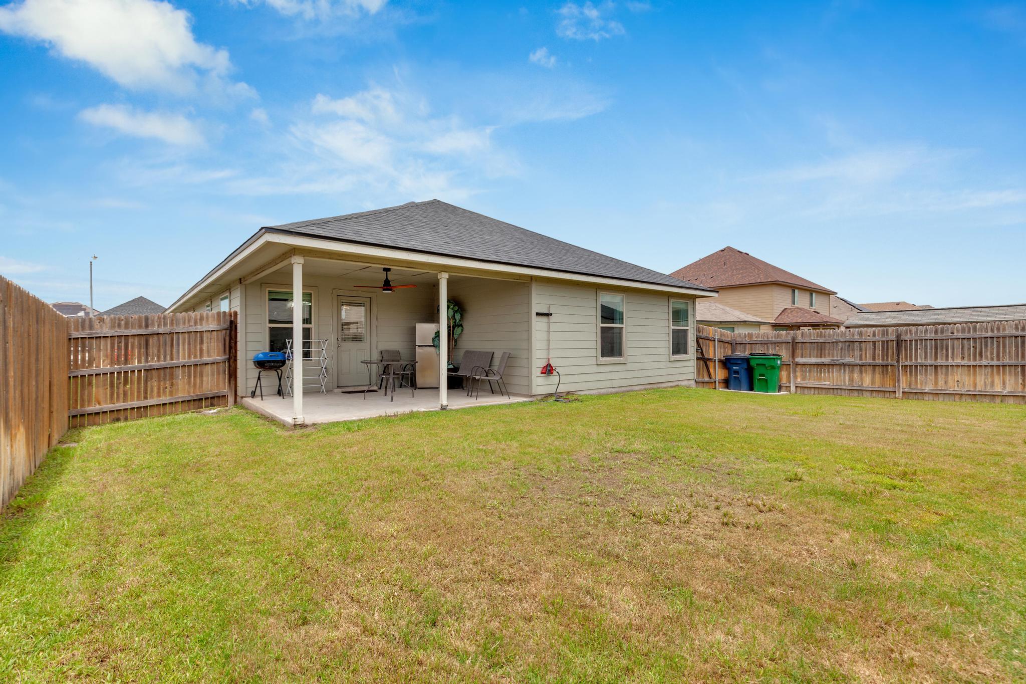 119 Beth Ann Loop Taylor, TX 76574 - Photo 28 of 31 Enjoy outdoor living with a spacious covered patio and private backyard.