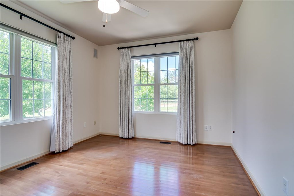 237 Implement Road Aiken, SC 29803 - Photo 21 of 43 an empty room with wooden floor and windows