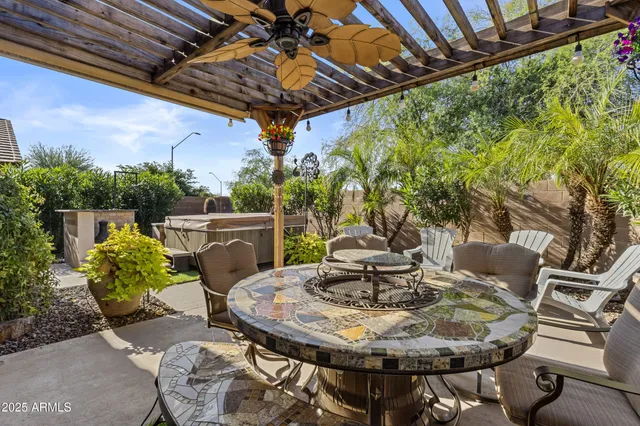 a view of a chairs and table in the patio