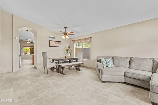 a living room with furniture and a table