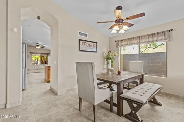 a view of a livingroom with furniture and a window
