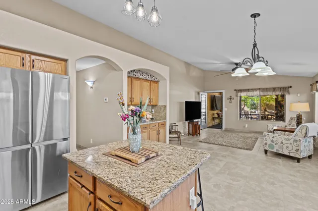 a view of a kitchen area kitchen island furniture and refrigerator