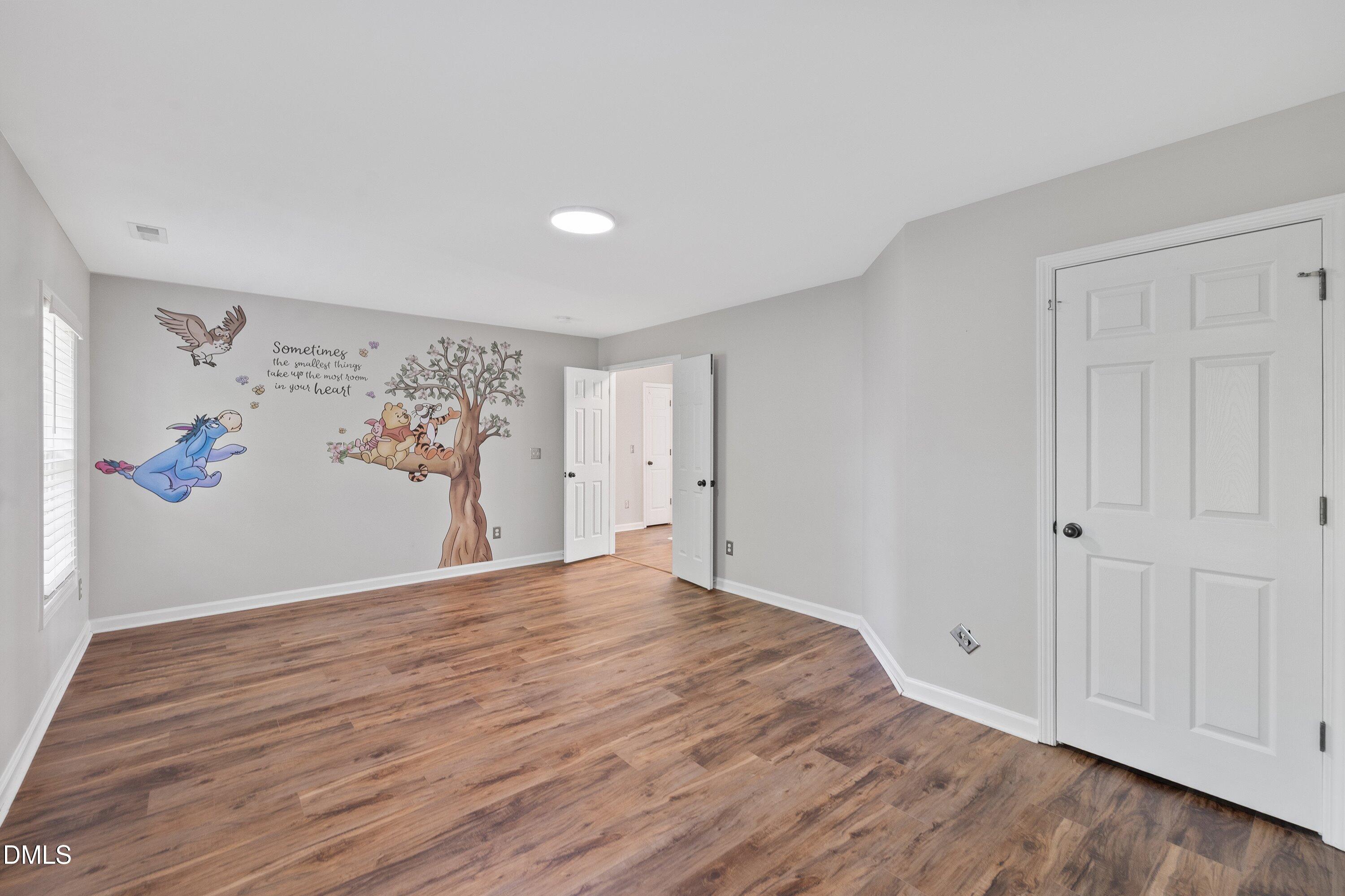 3717 Windmeade Road Wake Forest, NC 27587 - Photo 40 of 51 a view of empty room with wooden floor