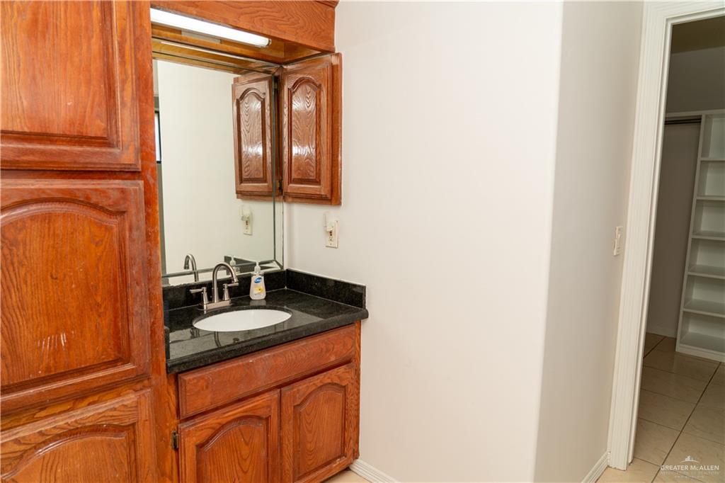 2009 Roman Street Mission, TX 78573 - Photo 21 of 22 a bathroom with a sink and a mirror