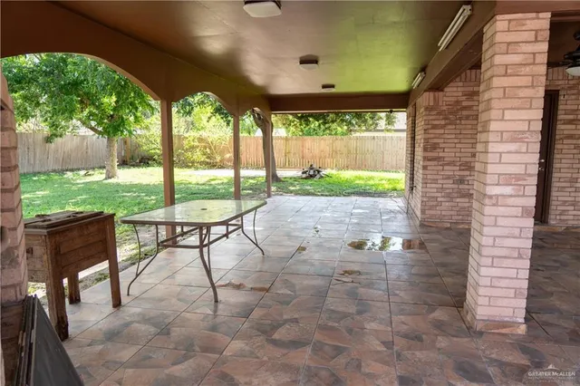 a view of a porch with furniture and yard