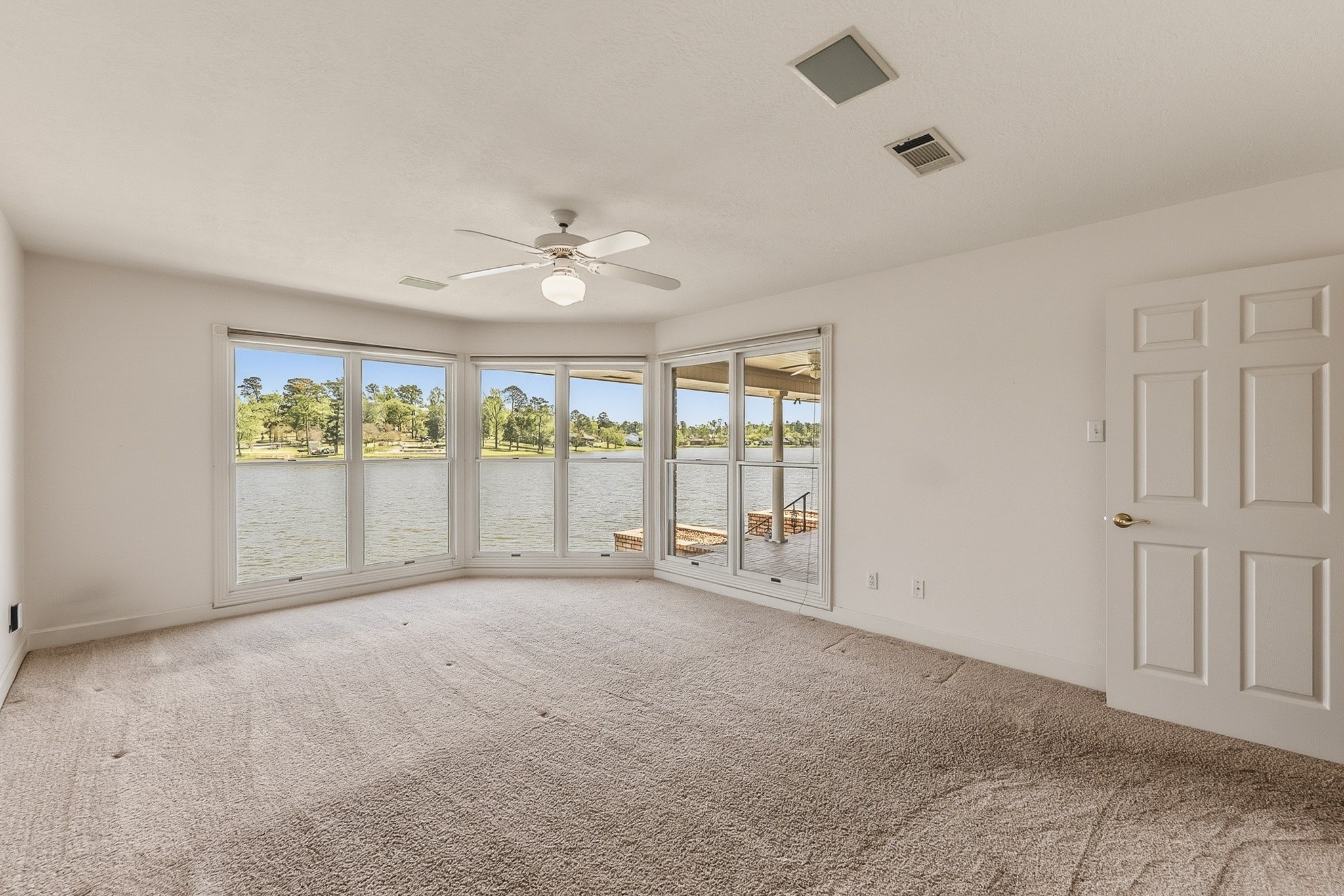 2008 Wickersham Drive Huntsville, TX 77340 - Photo 3 of 44 Wake up in the Primary Bedroom to the Beautiful Elkins Lake!