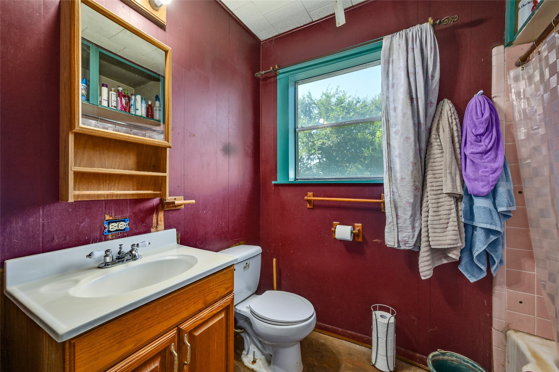 681 County Road 474 Elgin, TX 78621 - Photo 12 of 37 a bathroom with a sink a toilet and a mirror