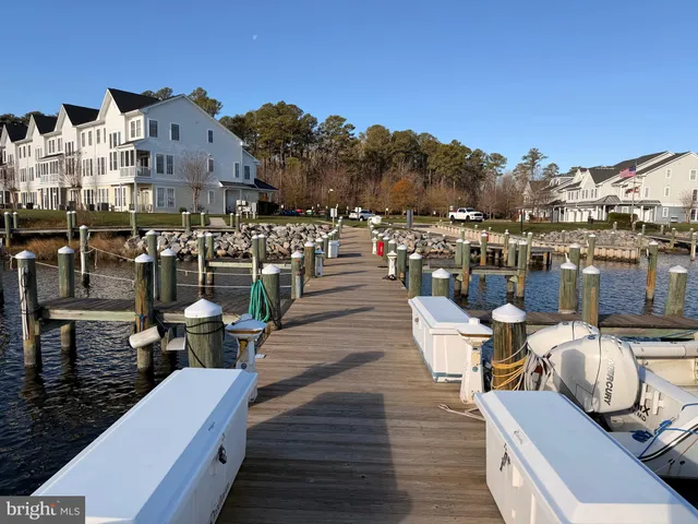 a picture of a patio with lawn chairs