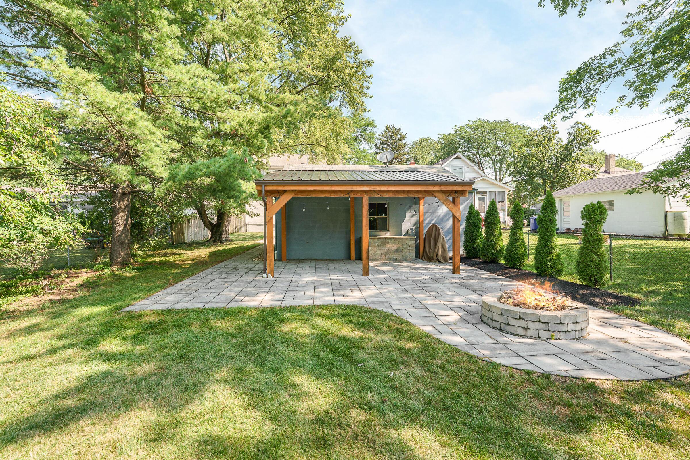 163 Garden Road Columbus, OH 43214 - Photo 5 of 46 The back, covered patio and firepit offer amazing space to extend living outside with an ideal entertainment space.