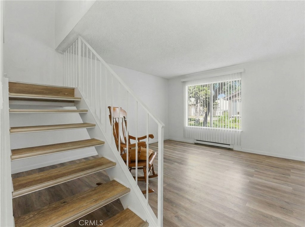 7085 Fulton Way Stanton, CA 90680 - Photo 11 of 34 a view of entryway and hall with wooden floor