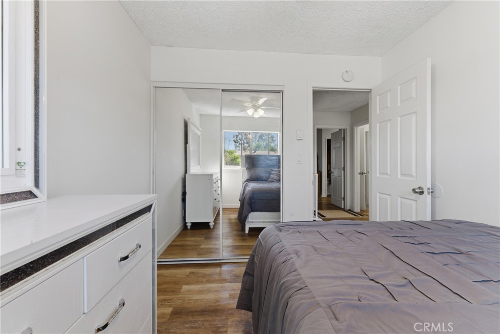 7085 Fulton Way Stanton, CA 90680 - Photo 15 of 34 a bedroom with a bed and a chandelier