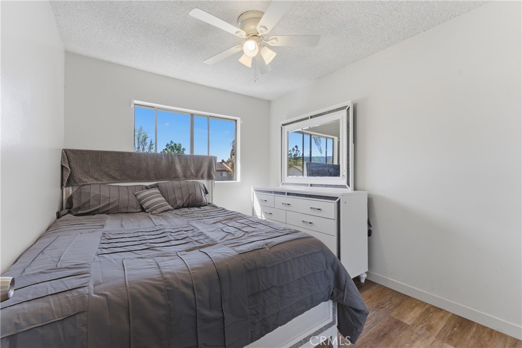 7085 Fulton Way Stanton, CA 90680 - Photo 17 of 34 a bedroom with a bed and a window