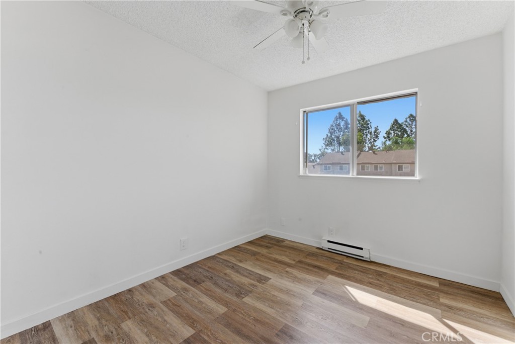 7085 Fulton Way Stanton, CA 90680 - Photo 19 of 34 an empty room with a painting on the wall