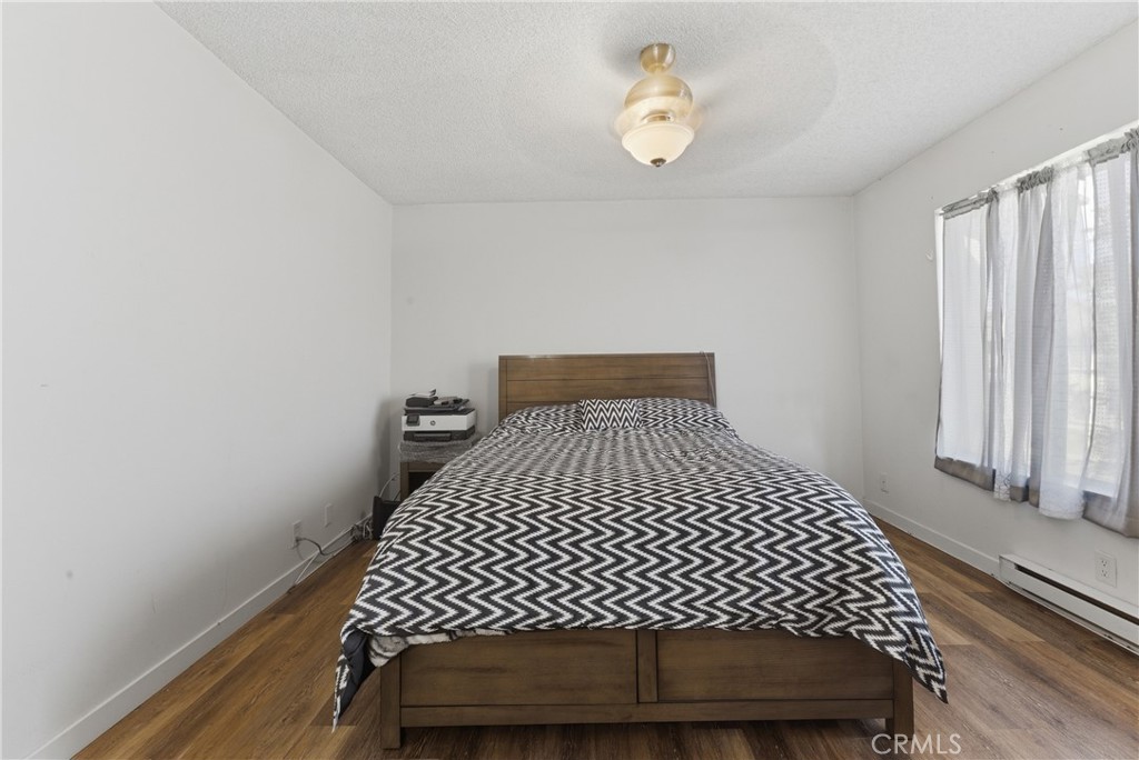 7085 Fulton Way Stanton, CA 90680 - Photo 20 of 34 a bedroom with a bed and window