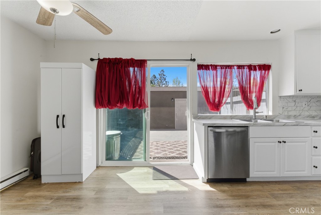 7085 Fulton Way Stanton, CA 90680 - Photo 5 of 34 a kitchen with stainless steel appliances granite countertop a stove a sink and a refrigerator
