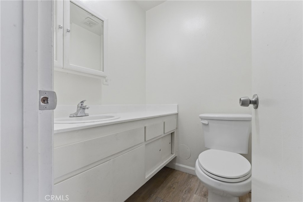 7085 Fulton Way Stanton, CA 90680 - Photo 8 of 34 a bathroom with a sink and a toilet